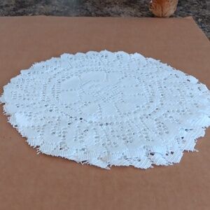 Six white Doillies